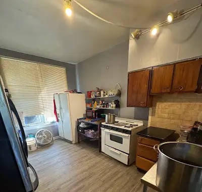 5025 South Ashland Avenue — Kitchen with wood cabinets and range